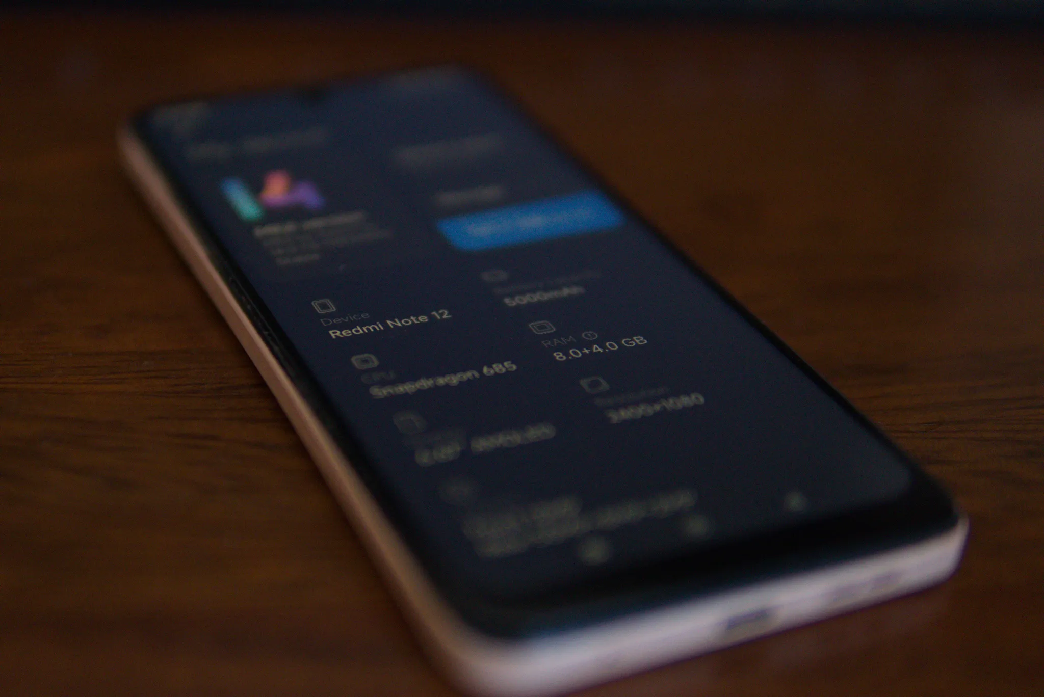 Redmi Note 12 lying on a desk with Termux open on the screen.